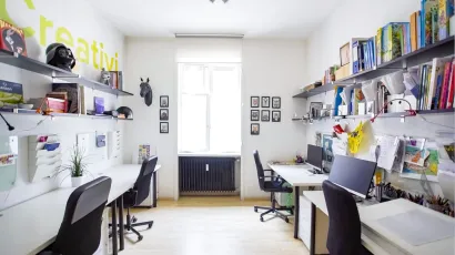 4 workstations at coworking space in Milan