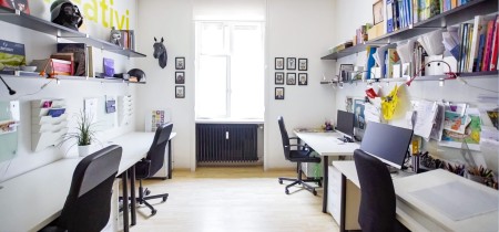 4 workstations at coworking space in Milan
