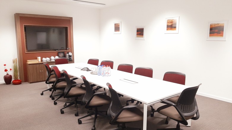 luxurious boardroom with screen twelve people