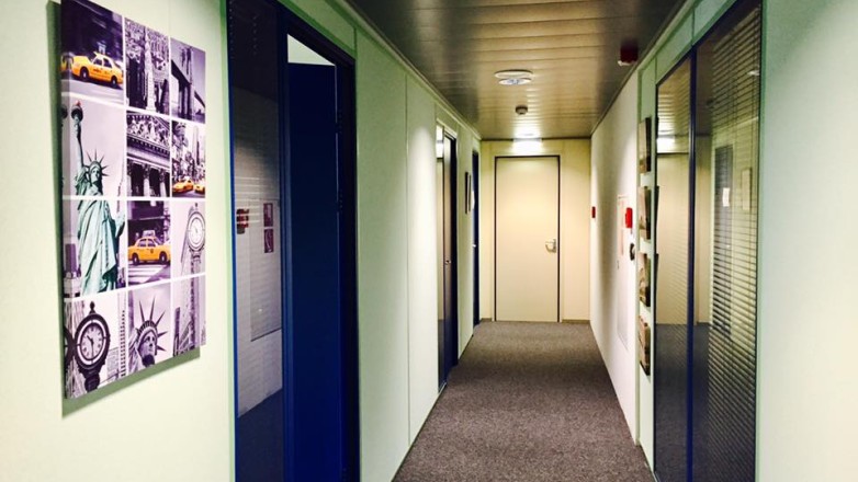 Hallway with entrances to office units