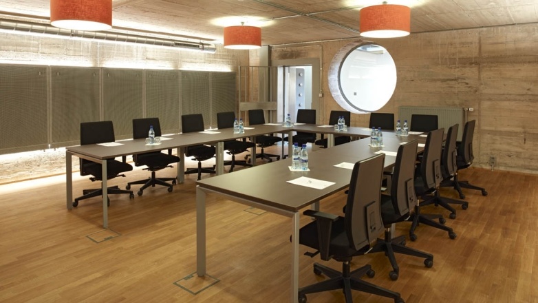 Spacious boardroom for presentations fourteen people